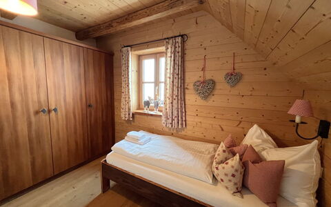 Sankt Michael im Lungau 800: Furniture, Interior Design, Bed, Flooring, Floor, Bedroom, Wood, Room, Bedding, Bed Sheet