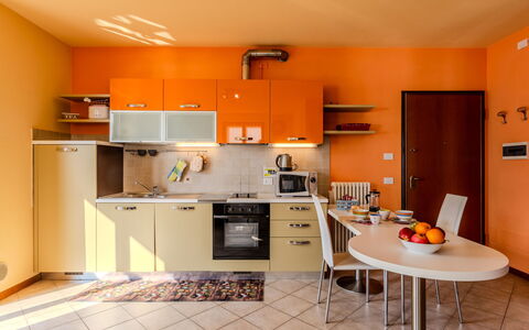 Vista Lago: Interior Design, Furniture, Kitchen, Flooring, Wood, Room, Ceiling, Countertop, Orange, Floor