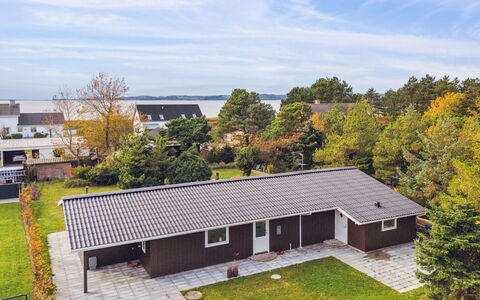 Ilva - 250M from the Sea: Roof, Home, Door, Cottage, Shade, Siding, Yard, Estate, Backyard