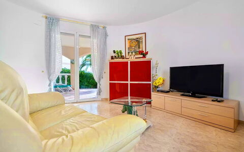 Villa Manuela: Furniture, Property, Couch, Comfort, Interior Design, Plant, Television, Living Room, Yellow, Wood
