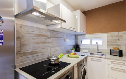 Aida 202: Countertop, Kitchen, Kitchen Appliance, Major Appliance, Cabinetry, Flooring, Interior Design, Wood, Furniture, Home Appliance