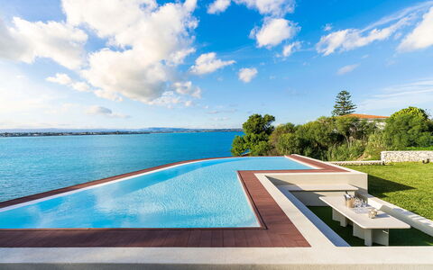 Villa Maddalena - Siracusa, Sicilia: Cloud, Water, Sky, Water Resources, Building, Plant, Swimming Pool, Outdoor Furniture, Natural Landscape, Rectangle