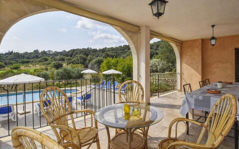 Pla de Ses Rotes: Table, Sky, Furniture, Property, Plant, Chair, Outdoor Table, Outdoor Furniture, Tableware, Building