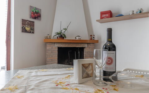 Il Colle Sul Mare Holiday Home: Bottle, Table, Picture Frame, Drinkware, Wood, Barware, Cabinetry, Building, Alcoholic Beverage, Glass Bottle