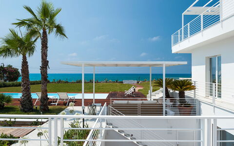 Casa Mareblu - Marina Di Modica, Sicilia: Sky, Plant, Building, Water, Azure, Shade, Cloud, Tree, Urban Design, Condominium