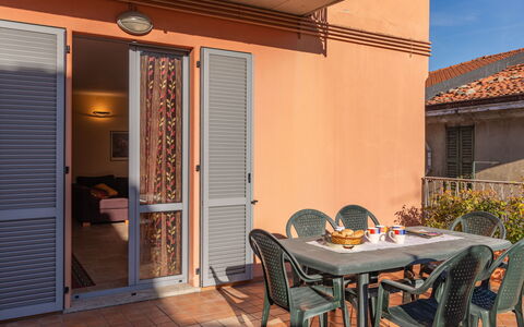 La Terrazza sul Borgo: Table, Property, Window, Building, Plant, Chair, Shade, Wood, Sky, Orange