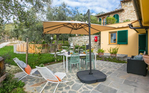 Villa Anna: Table, Furniture, Flower, Property, Cloud, Sky, Plant, Building, Chair, Shade