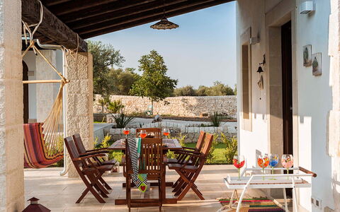 Corte Carrubo - Rosolini, Sicilia: Furniture, Plant, Table, Building, Chair, Sky, Wood, Shade, Outdoor Furniture, Tree