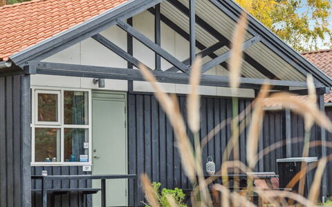 Gudrund - 250M from the Sea: Roof, House, Home, Cottage, Door, Siding, Deck, Porch, Plank, Hardwood