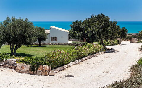 Isolina Bianca - Scicli, Sicilia: Sky, Plant, Property, Water, Tree, Natural Landscape, Land Lot, House, Building, Grass