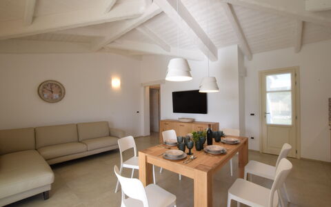 Villa Helios - Budoni, Sardegna: Furniture, Property, Table, Couch, Lighting, Wood, Interior Design, Window, Living Room, Comfort