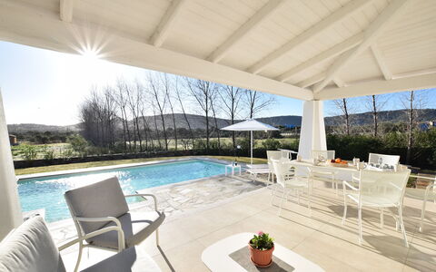 Villa Helios - Budoni, Sardegna: Water, Sky, Plant, Property, Furniture, Table, Chair, Swimming Pool, Shade, Window