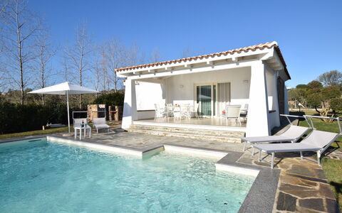 Villa Helios - Budoni, Sardegna: Water, Sky, Plant, Property, Building, Azure, Swimming Pool, Tree, Shade, Chair