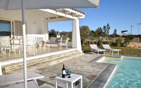 Villa Helios - Budoni, Sardegna: Water, Sky, Furniture, Property, Chair, Outdoor Furniture, Plant, Shade, Interior Design, Architecture