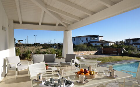 Villa Helios - Budoni, Sardegna: Sky, Water, Flowerpot, Chair, Plant, Shade, Outdoor Furniture, Building, Houseplant, Residential Area