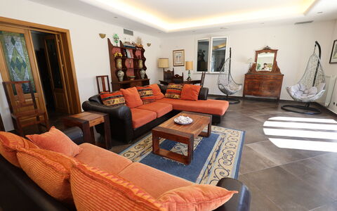 Villa Rosarno: Picture Frame, Furniture, Couch, Table, Comfort, Wood, Living Room, Studio Couch, Orange, Lamp