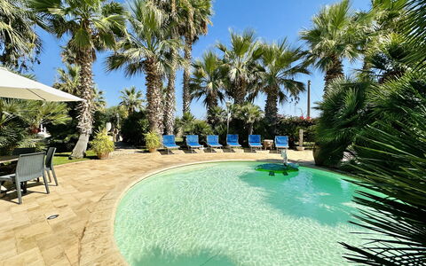 Villa Rosarno: Water, Plant, Furniture, Swimming Pool, Azure, Sky, Tree, Outdoor Furniture, Seaside Resort, Chair