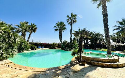 Villa Rosarno: Water, Plant, Sky, Property, Swimming Pool, Tree, Azure, Shade, Body Of Water, Arecales