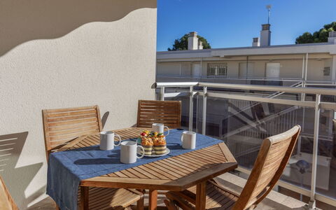 Cala Llobeta: Table, Furniture, Property, Chair, Outdoor Table, Azure, Building, Sky, Wood, Outdoor Furniture