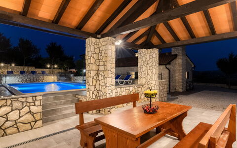 Villa Škavre: Table, Property, Furniture, Interior Design, Lighting, Wood, Couch, Outdoor Furniture, Living Room, Real Estate