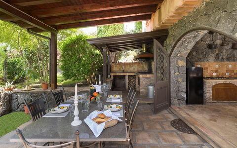 Oasi Verde - Santa Maria La Stella, Sicilia: Furniture, Plant, Table, Building, Wood, Flowerpot, Chair, Houseplant, Shade, Tree