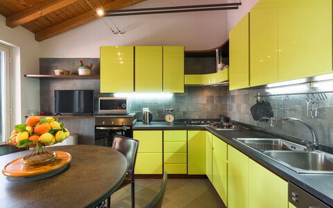 Oasi Verde - Santa Maria La Stella, Sicilia: Cabinetry, Kitchen Sink, Countertop, Furniture, Sink, Table, Interior Design, Kitchen, Orange, Lighting