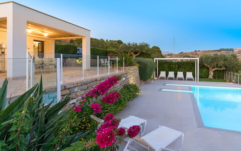 Mirabilia - Tangi, Sicilia: Plant, Sky, Property, Flower, Water, Outdoor Furniture, Shade, Architecture, Building, Grass