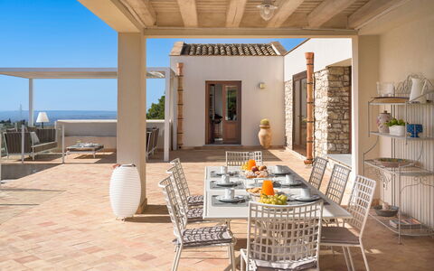 Mirabilia - Tangi, Sicilia: Property, Furniture, Sky, Building, Wood, Table, Chair, Interior Design, Architecture, Shade