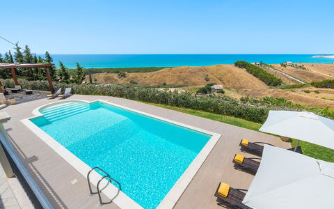 Villa Vistamare - Montallegro, Sicilia: Water, Sky, Plant, Building, Azure, Swimming Pool, Outdoor Furniture, Rectangle, Shade, Chair