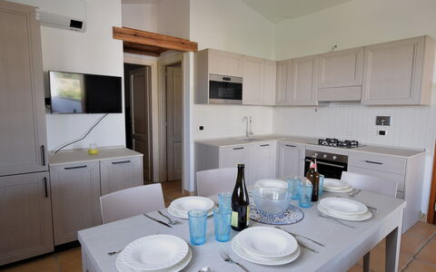 Luisa Apartment In Budoni, Shared Pool: Cabinetry, Countertop, Property, Kitchen Appliance, Dishware, Tableware, Interior Design, Kitchen, Home Appliance, Floor
