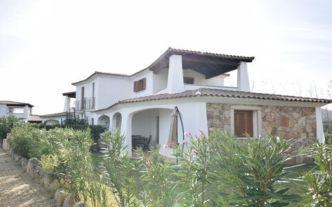 Luisa Apartment In Budoni, Shared Pool: Sky, Plant, Building, Cloud, Property, Window, House, Land Lot, Cottage, Neighbourhood
