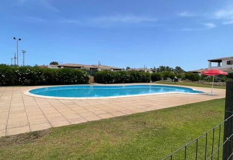Luisa Apartment In Budoni, Shared Pool: Water, Sky, Plant, Swimming Pool, Cloud, Building, Shade, Rectangle, Grass, Tree