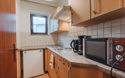 Bad Gastein 550: Cabinetry, Countertop, Furniture, Property, Sink, Tap, Kitchen, Building, Kitchen Stove, Wood