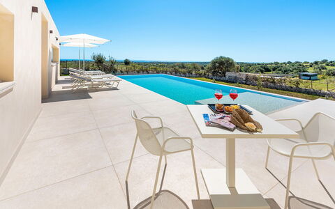 Villa Argento - Rosolini, Sicilia: Sky, Building, Azure, Outdoor Furniture, Interior Design, Shade, Table, Swimming Pool, Leisure, Urban Design