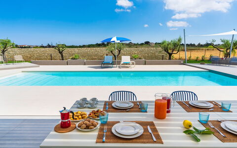Casa Colori - Noto, Sicilia: Plant, Water, Sky, Property, Table, Tableware, Cloud, Azure, Swimming Pool, Outdoor Furniture