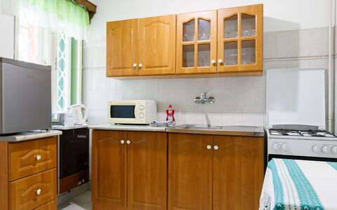 Stella: Cabinetry, Countertop, Furniture, Property, Kitchen Sink, Building, Sink, Kitchen, Drawer, Wood