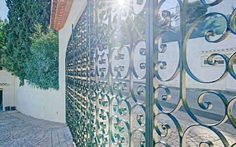 Villa Zamorita: Azure, Tree, Plant, Font, Art, Facade, Landmark, Glass, Tints And Shades, Urban Area