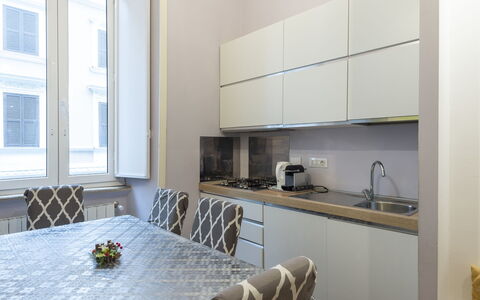 Porta Magica: Property, Cabinetry, Window, Countertop, Kitchen Stove, Interior Design, Wood, Flooring, Floor