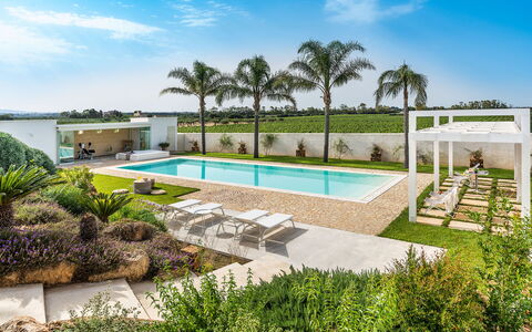 Casa Ocra - Misiliscemi, Sicilia: Plant, Sky, Cloud, Water, Property, Tree, Azure, Swimming Pool, Shade, Architecture
