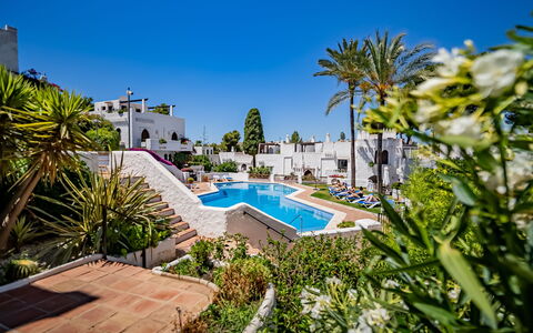 Atalaya Rio Verde: Sky, Plant, Daytime, Property, Water, Azure, Swimming Pool, Seaside Resort, Arecales, Tree