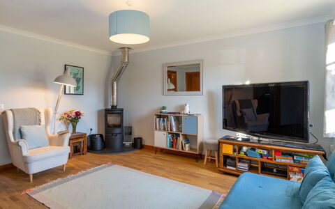 Cosagach Cottage: Couch, Property, Furniture, Wood, Picture Frame, Interior Design, Table, Floor, Living Room, Flooring
