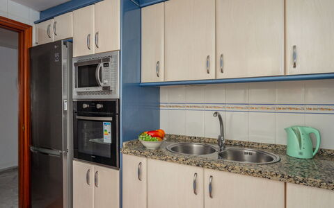 Las Terrazas: Kitchen, Major Appliance, Countertop, Cabinetry, Kitchen Appliance, Wood, Kitchen Sink, Flooring, Interior Design, Room
