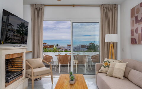 Ático Los Pelicanos: Furniture, Couch, Table, Comfort, Interior Design, Wood, Lighting, Shade, Living Room, Flooring
