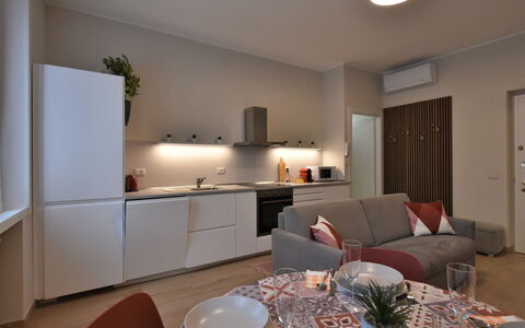 Pirelli Central Station Apartment: Furniture, Property, Table, Countertop, Cabinetry, Interior Design, Wood, Chair, Houseplant