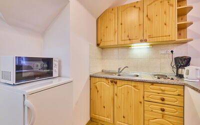 Villa Belvedere 20.8: Cabinetry, Property, Countertop, Building, Sink, Wood, Kitchen, Lighting, Kitchen Sink, Interior Design