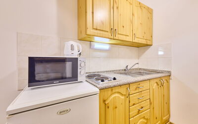 Villa Belvedere 20.9: Cabinetry, Building, Countertop, Furniture, Property, Kitchen Appliance, Kitchen, Kitchen Stove, Wood, Home Appliance