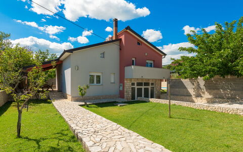Lucija: Residential Area, House, Home, Human Settlement, Garden, Estate, Lawn, Landscaping, Yard, Suburb