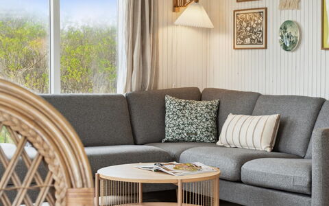 Zina - 600M from the Sea: Furniture, Living Room, Natural Material, Wood Stain, Hardwood, Chair, Wicker, Houseplant, Coffee Table