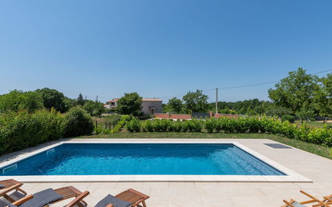 Villa Tola: Water, Plant, Swimming Pool, Sky, Azure, Rectangle, Shade, Tree, Grass, Leisure