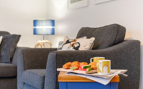 Marshmallow House: Couch, Furniture, Property, Table, Comfort, Picture Frame, Interior Design, Orange, Food, Studio Couch